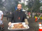 Church leader with fresh cooked souvlaki - Big Greek Food Fest, Niles