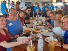 Church leader welcoming guests to the St. Nectarios Greek Fest in Palatine