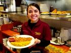 Friendly server with omelet at Annie's Pancake House in Skokie