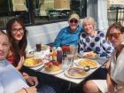 Family enjoying breakfast on the outdoor patio at Maple Butter Cafe in Plainfield