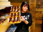 Friendly staff with chocolate eclairs at Papagalino Cafe & Pastry Shop in Niles