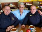 Friendly staff with police officers at Tasty Waffle Restaurant in Romeoville