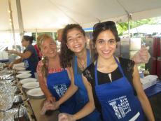 Friendly volunteers serving guests at The Big Greek Food Fest of Niles