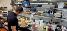 Busy kitchen crew at Maple Butter Cafe in Plainfield