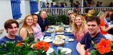 Family enjoying the outdoor patio at Mykonos Greek Restaurant in Niles