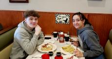 Friends enjoying pancakes and crepes at Niko's Breakfast Club in Romeoville