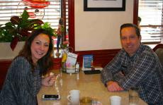 Couple enjoying breakfast at Omega Restaurant & Pancake House in Downers Grove