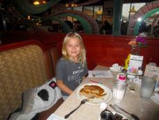 Youngster enjoying pancakes at Omega Restaurant & Pancake House in Downers Grove