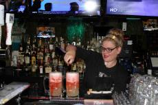 Friendly bar server preparing "Slammers" at Rocky's American Grill in Prospect Heights
