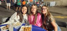 Guests enjoying Loukoumades at the St. Spyridon Greek Fest in Palos Heights