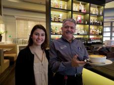 Friendly staff with Pastichio at Yanni's Greek Restaurant in Glenview