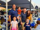 Family enjoying the Big Greek Food Fest of Niles