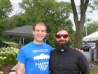 Church leader with volunteer - Glenview Greek Fest at Sts. Peter & Paul