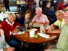 Friends enjoying Johnny's Kitchen & Tap Octoberfest in Glenview