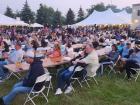 Visitors enjoying live music at the St. Demetrios Elmhurst Greek Fest