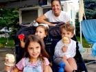 Mom and kids enjoying the St Demetrios Greek Fest in Elmhurst