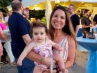 Mom and baby enjoying the St Demetrios Greek Fest in Elmhurst