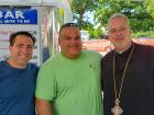 Church leader with festival staff - St. Sophia Greekfest, Elgin