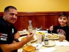 Father and son enjoying breakfast at Annie's Pancake House in Skokie