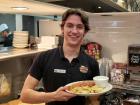 Friendly waiter serving breakfast - Around The Clock Restaurant in Crystal Lake