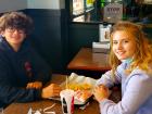 Friends enjoying cheese fries at Billy Boy's Restaurant in Chicago Ridge