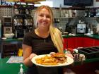 Friendly server with brisket sandwich at The Canteen Restaurant in Barrington