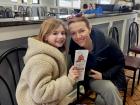 Mom and daughter getting carryout at Charcoal Flame Grill in Morton Grove