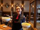 Server with salads at Ellwood Steak and Fish House in DeKalb