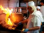 Cheeseburgers on the grill at Nick's Drive In Restaurant Chicago