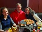 Family enjoying live music and dinner at Niko's Red Mill Tavern in Woodstock