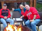 Family enjoying the outdoor beer garden at Niko's Red Mill Tavern in Woodstock