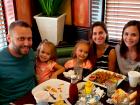 Family enjoying dinner at Rose Garden Cafe in Elk Grove Village 