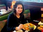 Happy customer enjoying dinner at Rose Garden Cafe in Elk Grove Village 