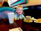 Young customer enjoying dinner at Rose Garden Cafe in Elk Grove Village 