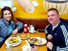 Couple enjoying breakfast at Tasty Waffle Restaurant in Romeoville