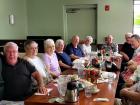 Friends enjoying breakfast at Tasty Waffle Restaurant in Plainfield