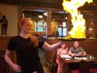 Serving flaming saganaki at Village Squire Restaurant South Elgin
