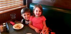 Siblings enjoying lunch at Andrew's Open Pit & Spirits in Park Ridge