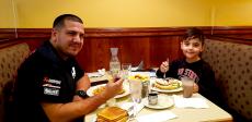 Father and son enjoying breakfast at Annie's Pancake House in Skokie