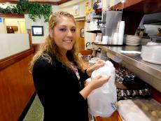 Friendly staff preparing carry-out order at Annie's Pancake House in Skokie