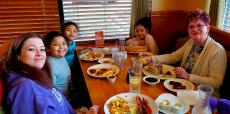 Family enjoying breakfast at Apple Villa Pancake House in Hoffman Estates