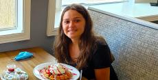 Happy customer enjoying breakfast at Bentley's Pancake House in Wood Dale