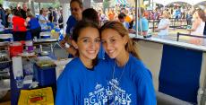 Friendly volunteers working at The Big Greek Food Fest in Niles