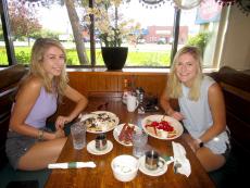 Friends enjoying breakfast treats at Billy's Pancake House in Palatine