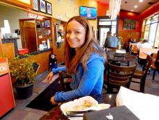 Happy customer enjoying lunch at Brandy's Gyros in Chicago