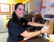 Friendly staff preparing one of Brandy's Gyros famous milkshakes