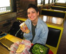 Loyal customer enjoying lunch at Burger Baron Restaurant Chicago