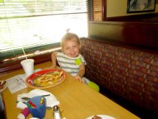 Youngster enjoying breakfast with her family at Canteen Restaurant in Barrington