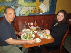 Customers enjoying chicken salad and spinach pie at Central Gyros Chicago