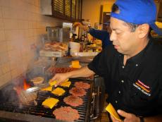 Busy grill man at Charcoal Delights Restaurant in Chicago